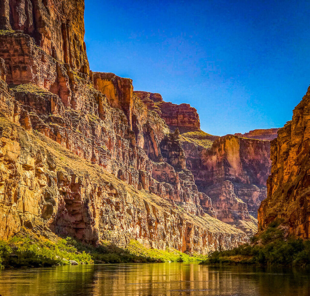 Grand Canyon cliffs at sunrise | Photo by Sinjin Eberle